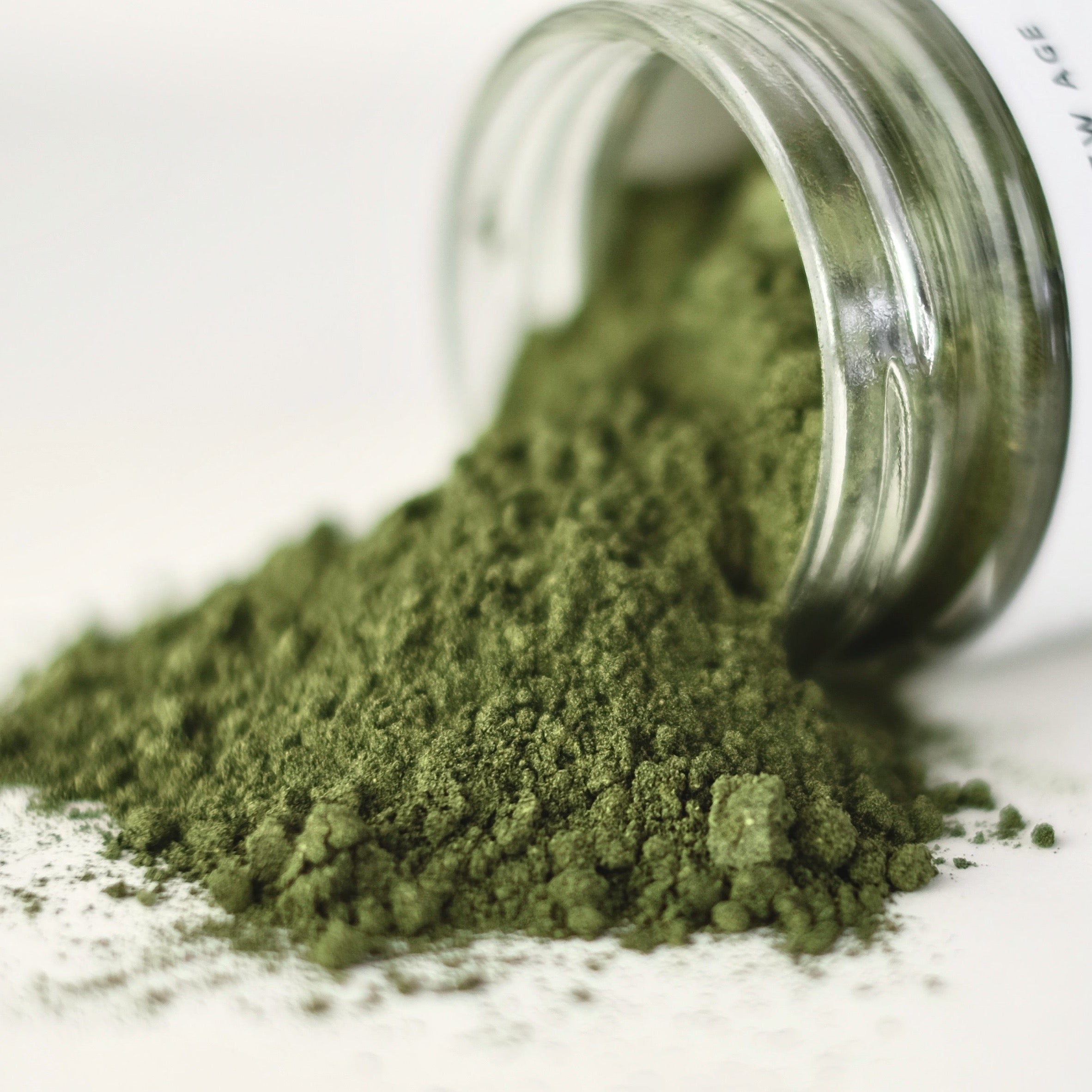 A close up of spirulina and kelp powder. This product is called Poseidon's Potion and is formulated by The New New Age.