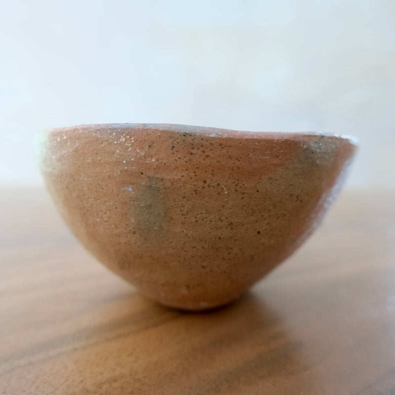 Pit fired micaceous clay earthenware tea bowl by The New New Age. 