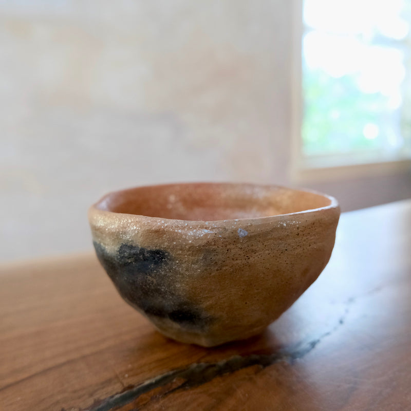 Pit fired micaceous clay earthenware tea bowl by The New New Age.