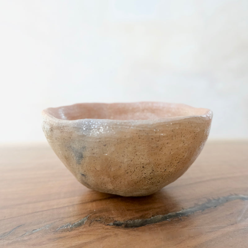 Micaceous clay earthenware tea bowl by The New New Age. 