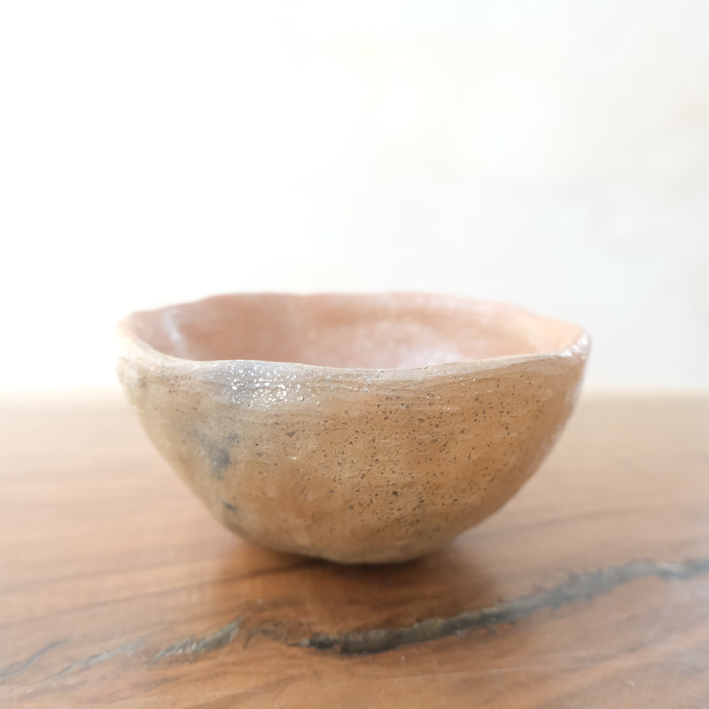 Micaceous clay earthenware tea bowl by The New New Age. 