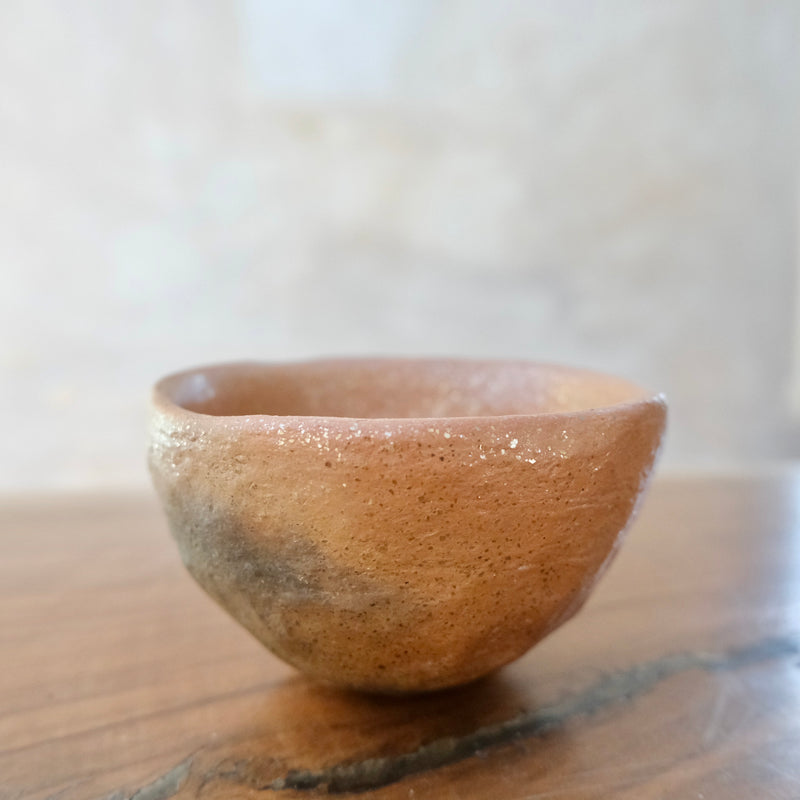 Micaceous clay earthenware tea bowl by The New New Age. 