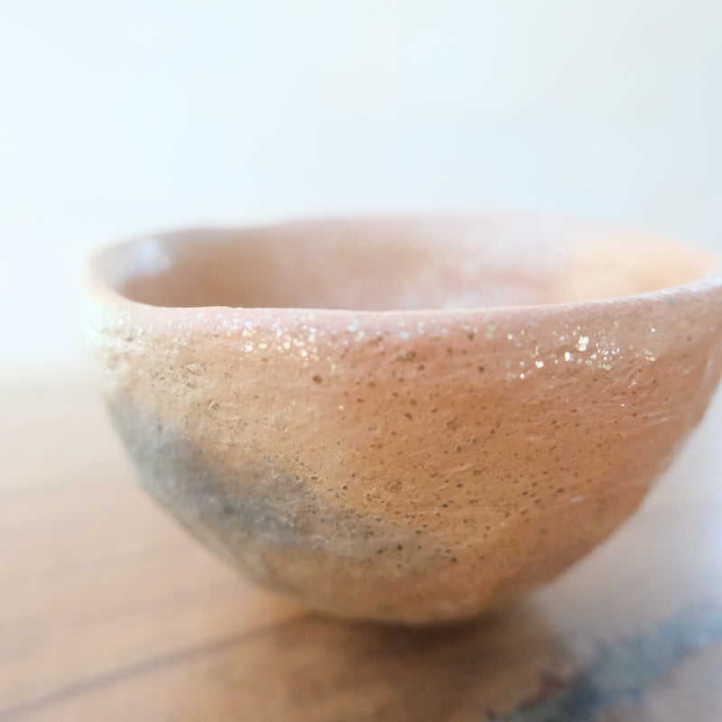 Micaceous clay earthenware tea bowl by The New New Age. 