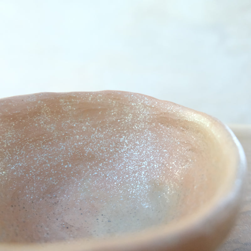 Micaceous clay earthenware tea bowl by The New New Age. 