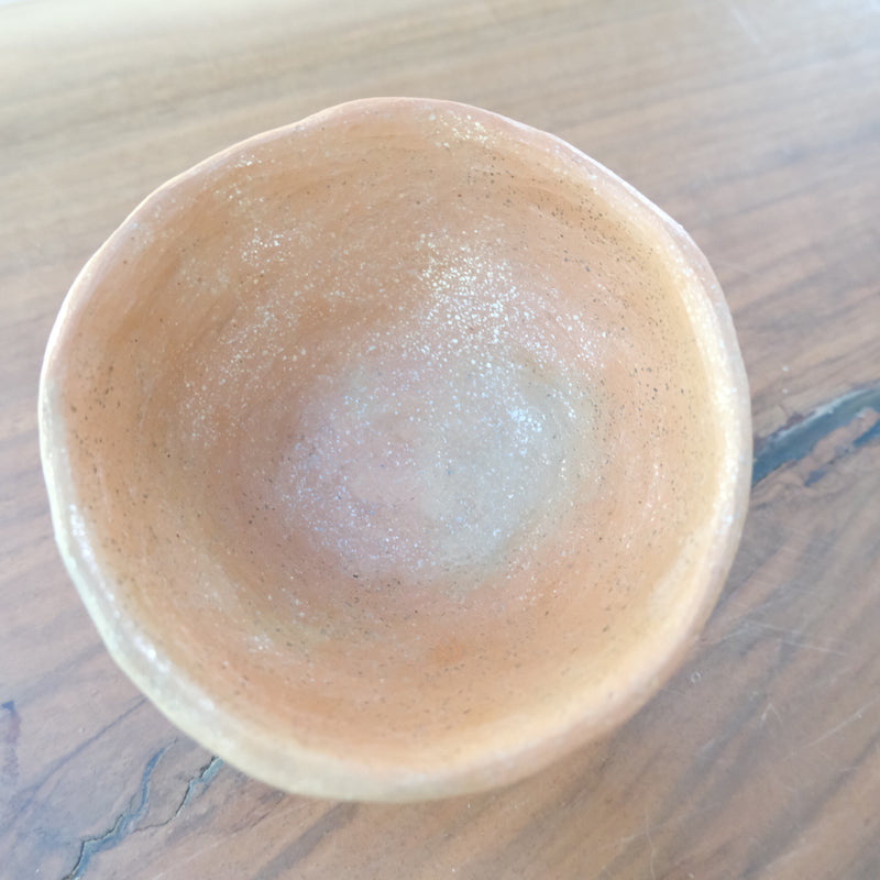 Micaceous clay earthenware tea bowl by The New New Age. 