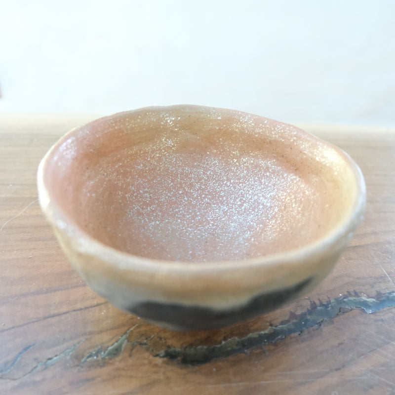 Pit fired micaceous clay earthenware tea bowl by The New New Age.