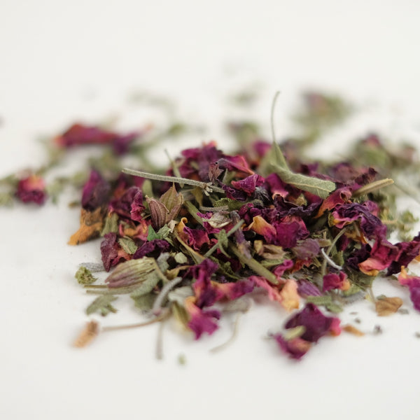 A close up of organic herbal tea, called Sub Rosa, featuring rhodiola root, rose petals, holy basil, sage. Formulated by The New New Age herb farm. 