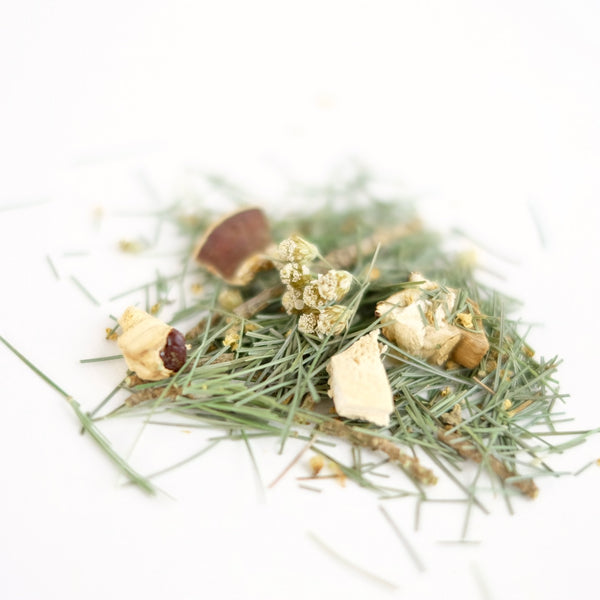 A close up of organic herbal tea called Tea of Peace, featuring eastern white pine, elder flower, yarrow and reishi mushroom. Formulated by The New New Age.