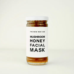 A jar of Mushroom Honey Face Mask by The New New Age. Featuring raw honey, wild foraged chaga mushroom powder, organic reishi and chaga dual extract, organic coriolus extract, organic cordyceps extract, organic lion's mane extract & maitake extract.